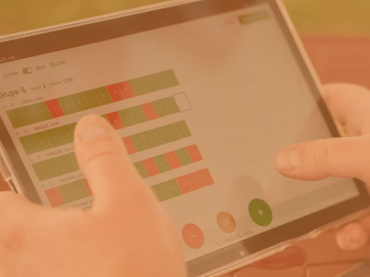 CLAYRESULTS.online on a tablet at a registration desk
